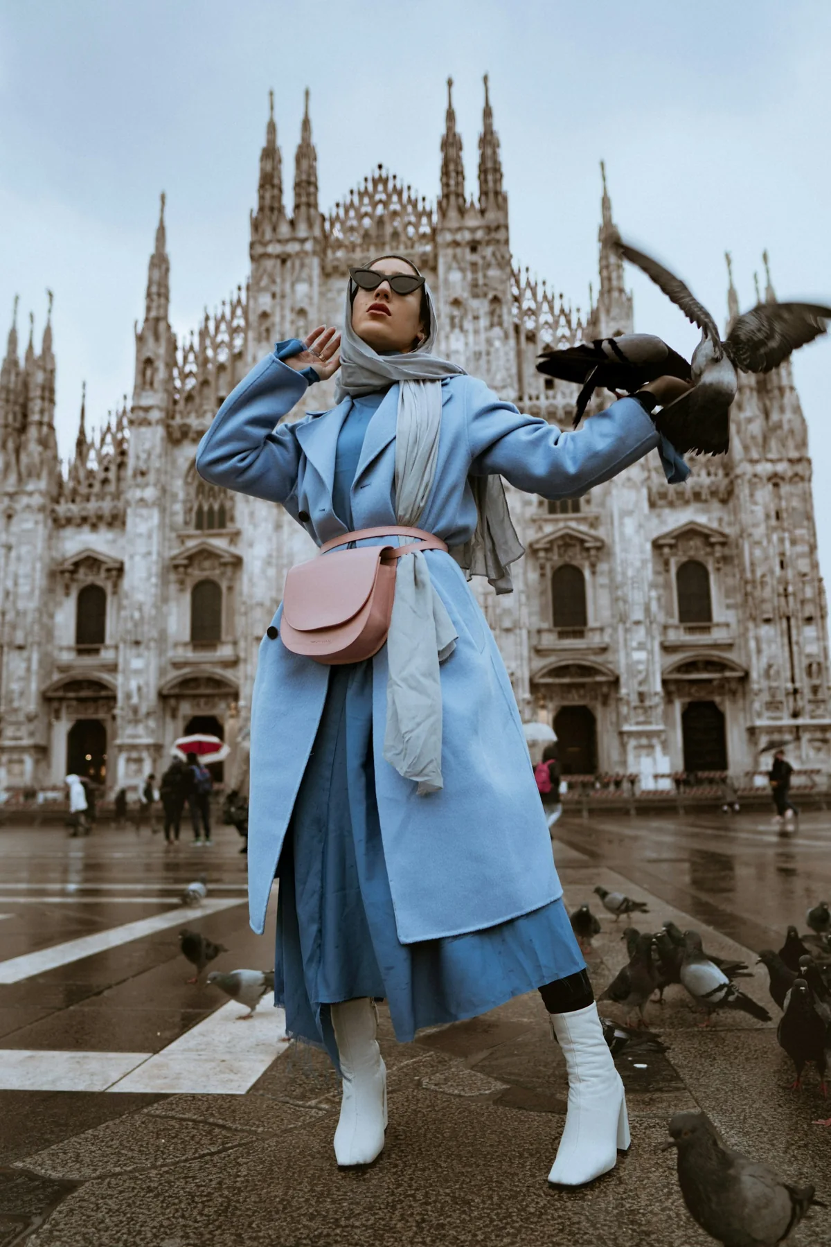 Blue tailored trench coat and leather shoulder bag, photographed in Milan