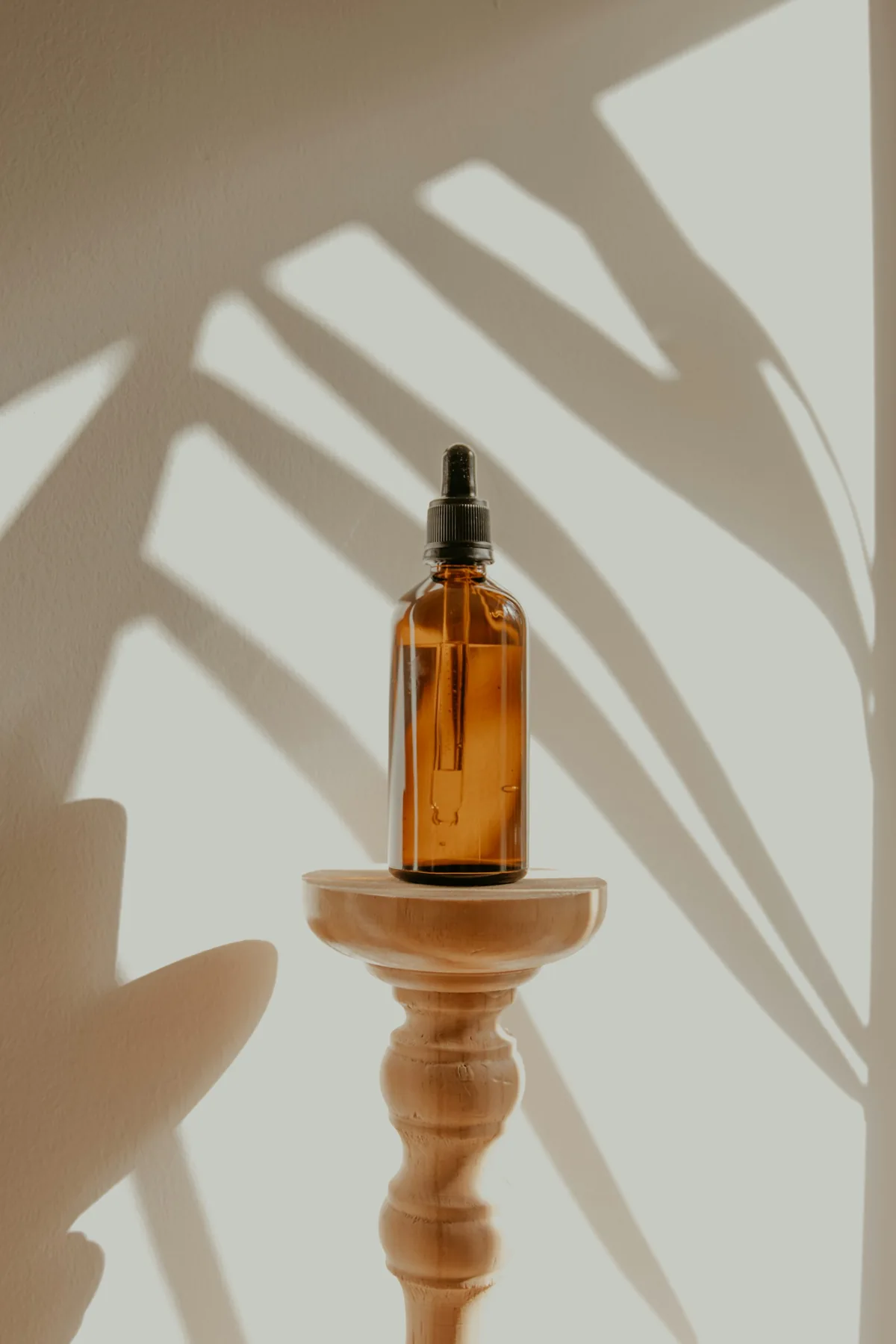 Amber botanical oil photographed in natural light